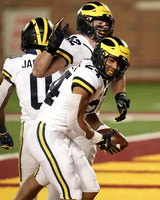 Giles Jackson (0), Blake Corum (2), and Ben Mason (42)