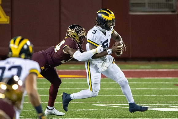 Joe Milton (5) and Erick All (83)