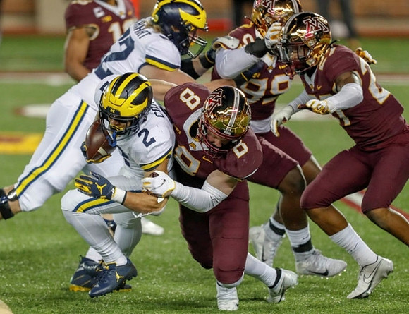 Blake Corum (2) and Karsen Barnhart (52)