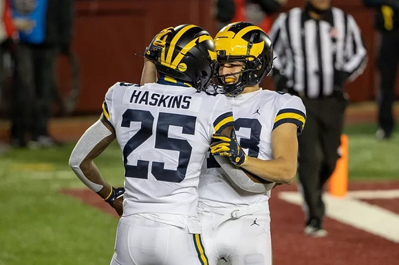 Hassan Haskins (25) and Jake McCurry (43)