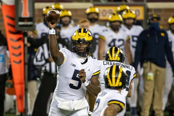 Joe Milton (5), Blake Corum (2), and Zach Charbonnet (24)