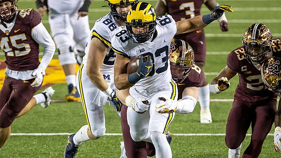 Erick All (83) and Luke Schoonmaker (86)