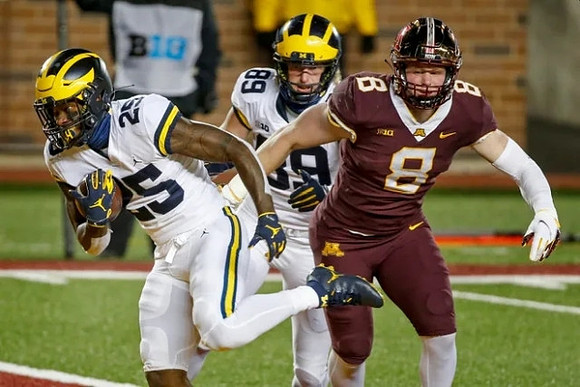 Hassan Haskins (25) and Carter Selzer (89)
