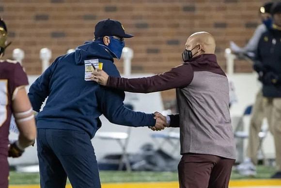 Jim Harbaugh and Minnesota Head Coach P. J. Fleck