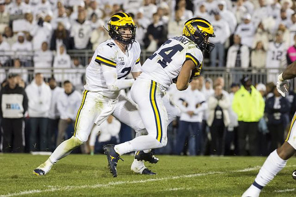 Shea Patterson (2) and Zach Charbonnet (24)