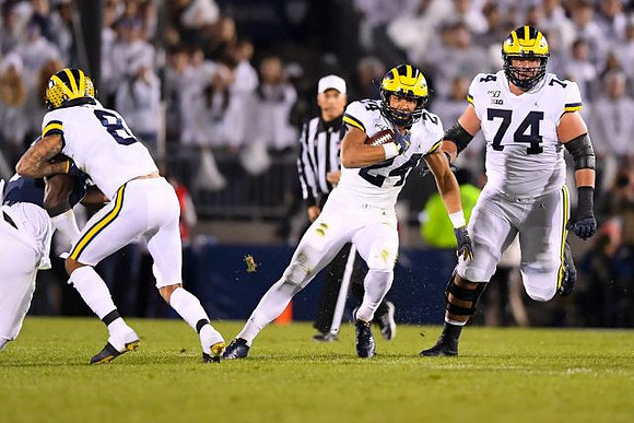 Ronnie Bell (8), Zach Charbonnet (24), and Ben Bredeson (74)