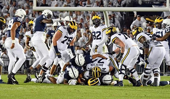 Jon Runyan Jr. (75), Zach Charbonnet (24), Nick Eubanks (82), Ben Bredeson (74), and Cesar Ruiz (51)