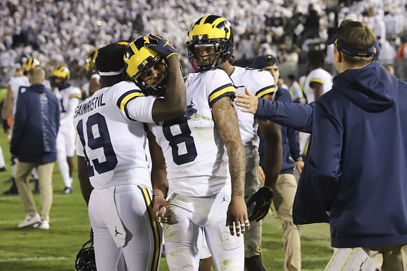 Mike Sainristil (19), Ronnie Bell (8), and Donovan Peoples-Jones (9)