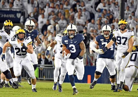 Kwity Paye (19), Jordan Glasgow (29), Khaleke Hudson (7), and Aidan Hutchinson (97)