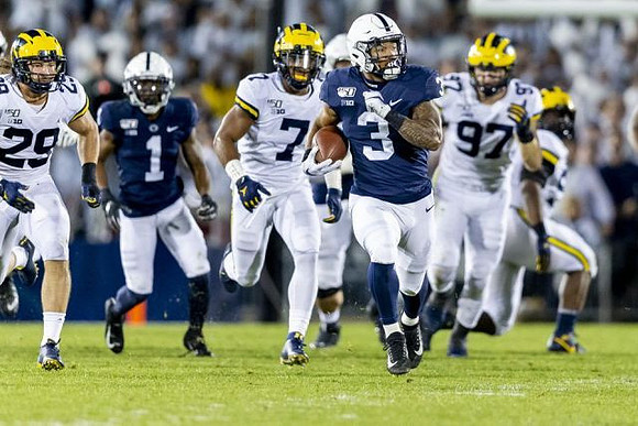 Jordan Glasgow (29), Khaleke Hudson (7), and Aidan Hutchinson (97)