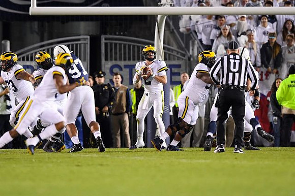 Jalen Mayfield (73), Shea Patterson (2), and Cesar Ruiz (51)