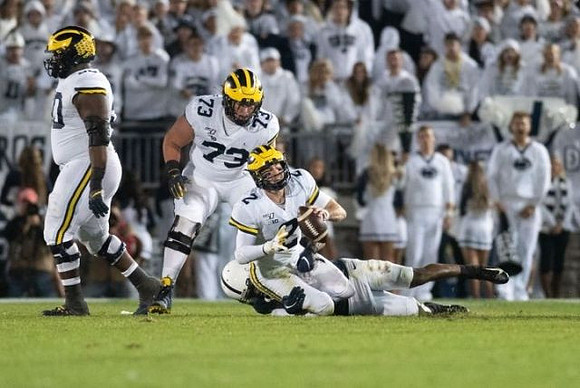 Michael Onwenu (50), Jalen Mayfield (73), and Shea Patterson (2)