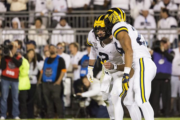 Shea Patterson (2) and Zach Charbonnet (24)