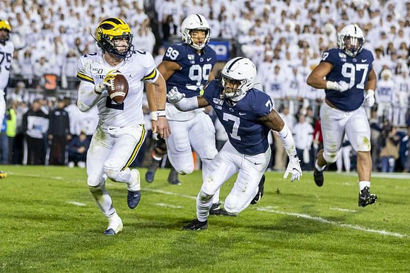 Jon Runyan Jr. (75) and Shea Patterson (2)