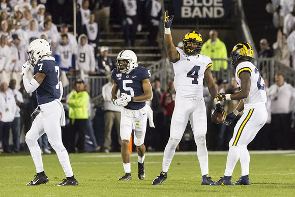 Nick Eubanks (82) and Hassan Haskins (25)