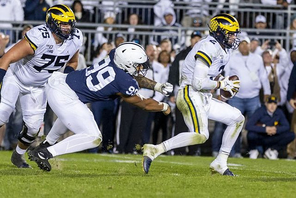 Jon Runyan Jr. (75) and Shea Patterson (2)