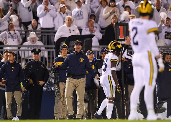 Jim Harbaugh, Hassan Haskins (25), and Shea Patterson (2)