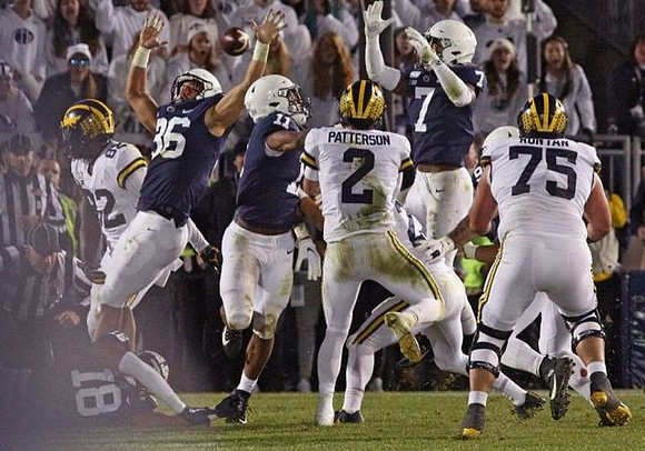 Nick Eubanks (82), Shea Patterson (2), and Jon Runyan Jr. (75)
