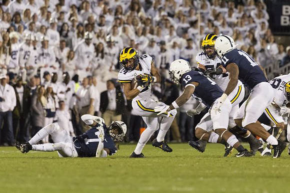 Zach Charbonnet (24), Ben Bredeson (74), and Ronnie Bell (8)