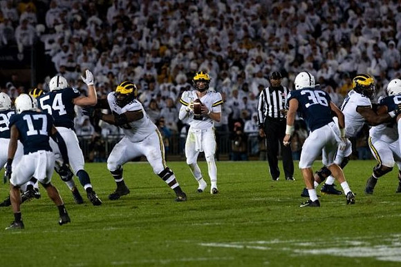 Michael Onwenu (50), Shea Patterson (2), and Cesar Ruiz (51)