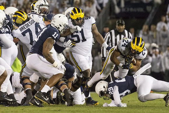 Ben Bredeson (74), Cesar Ruiz (51), and Zach Charbonnet (24)