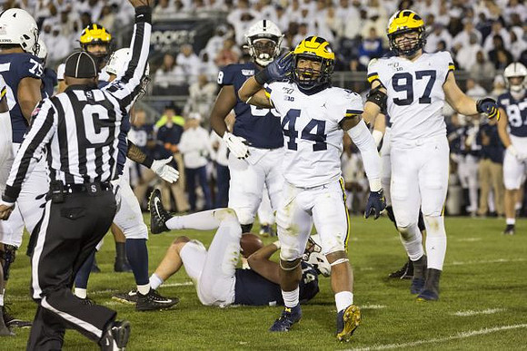Cameron McGrone (44) and Aidan Hutchinson (97)