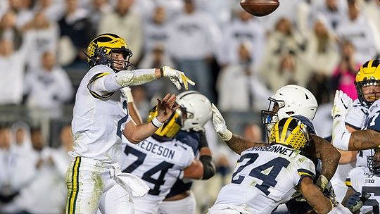 Shea Patterson (2), Ben Bredeson (74), Zach Charbonnet (24), and Jalen Mayfield (73)