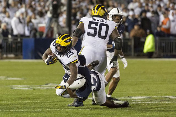 Hassan Haskins (25) and Michael Onwenu (50)