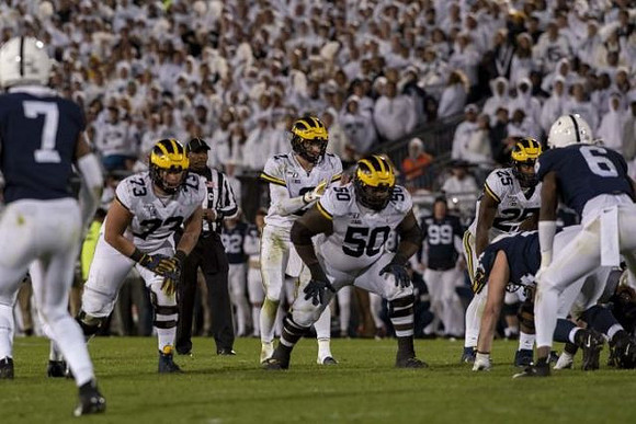 Jalen Mayfield (73), Shea Patterson (2), Michael Onwenu (50), and Hassan Haskins (25)