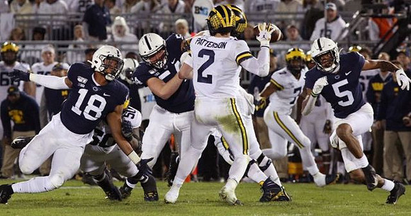 Shea Patterson (2) and Tarik Black (7)