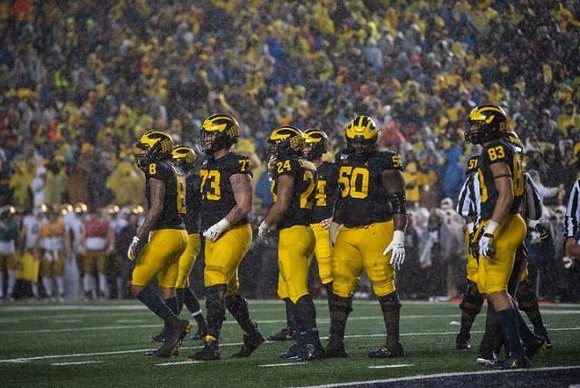 Ronnie Bell (8), Jalen Mayfield (73), Zach Charbonnet (24), Michael Onwenu (50), and Erick All (83)