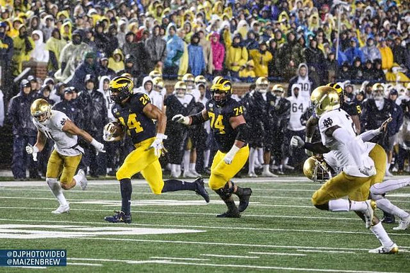 Zach Charbonnet (24) and Ben Bredeson (74)