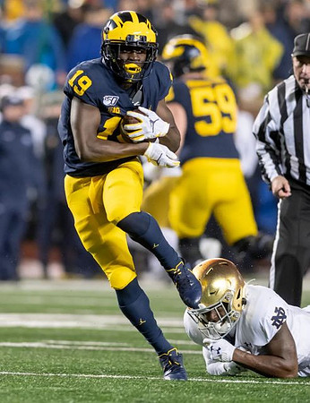 Mike Sainristil (19) and Joel Honigford (59)