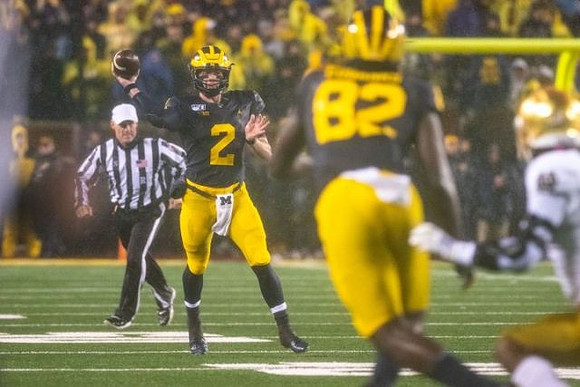 Shea Patterson (2) and Nick Eubanks (82)