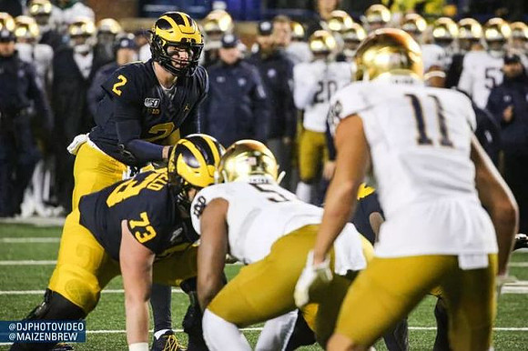 Shea Patterson (2) and Jalen Mayfield (73)