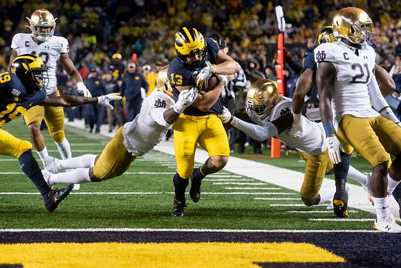 Mike Sainristil (19) and Tru Wilson (13)