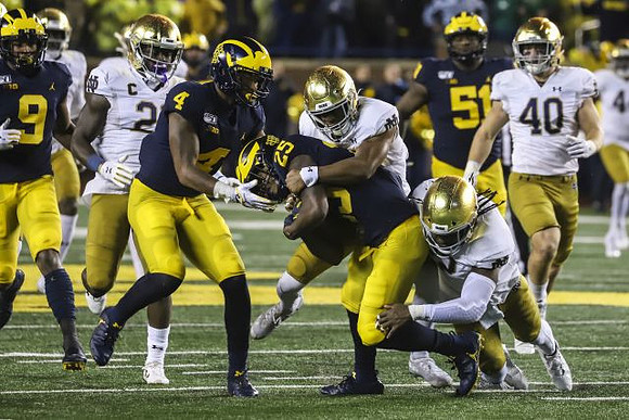 Donovan Peoples-Jones (9), Nico Collins (4), Hassan Haskins (25), and Cesar Ruiz (51)