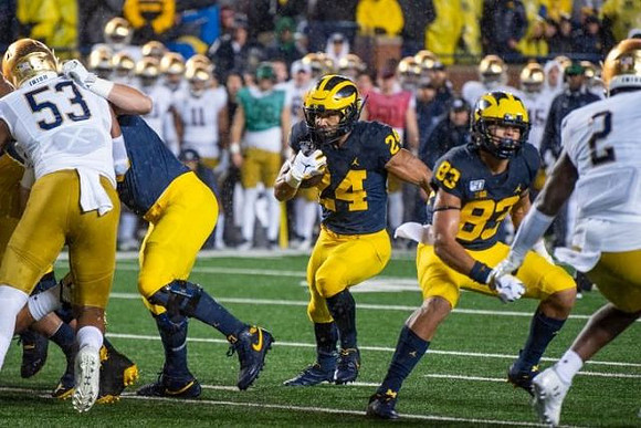 Zach Charbonnet (24) and Erick All (83)