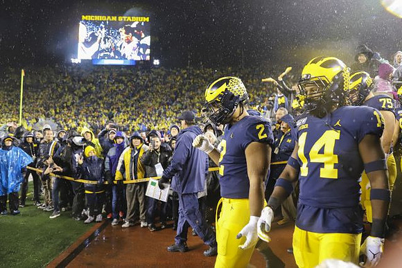 Shea Patterson (2), Jared Char (44), and Jon Runyan Jr. (75)