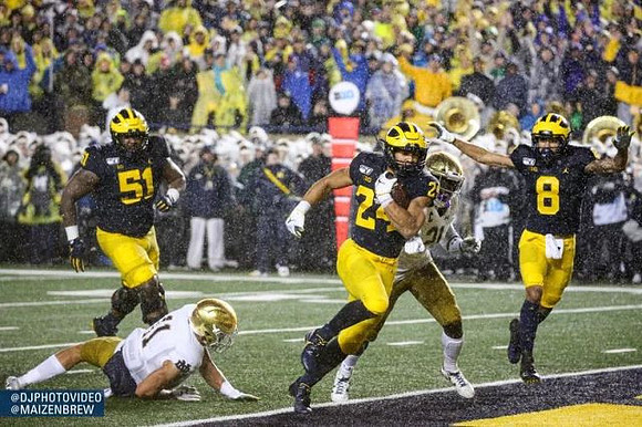 Cesar Ruiz (51), Zach Charbonnet (24), and Ronnie Bell (8)