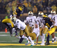 Hassan Haskins (25) and Ronnie Bell (8)