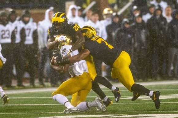 Brad Hawkins (20) and Khaleke Hudson (7)