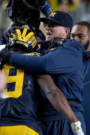 Donovan Peoples-Jones (9) and Jim Harbaugh