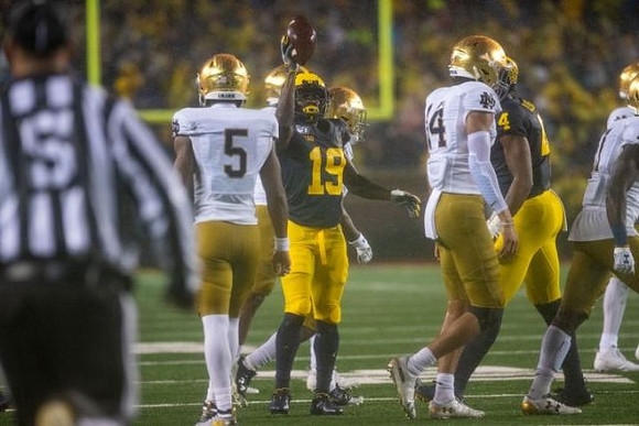 Mike Sainristil (19) and Nico Collins (4)