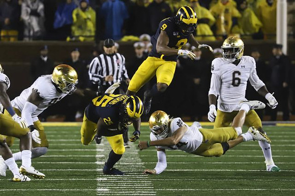 Hassan Haskins (25) and Donovan Peoples-Jones (9)