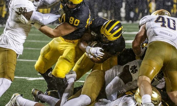 Ryan Hayes (80) and Zach Charbonnet (24)
