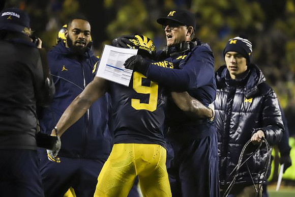 Donovan Peoples-Jones (9) and Jim Harbaugh