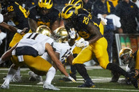 Nick Eubanks (82), Cesar Ruiz (51), and Hassan Haskins (25)