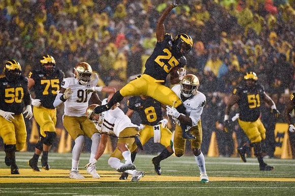 Michael Onwenu (50), Jon Runyan Jr. (75), Ronnie Bell (8), Hassan Haskins (25), and Cesar Ruiz (51)