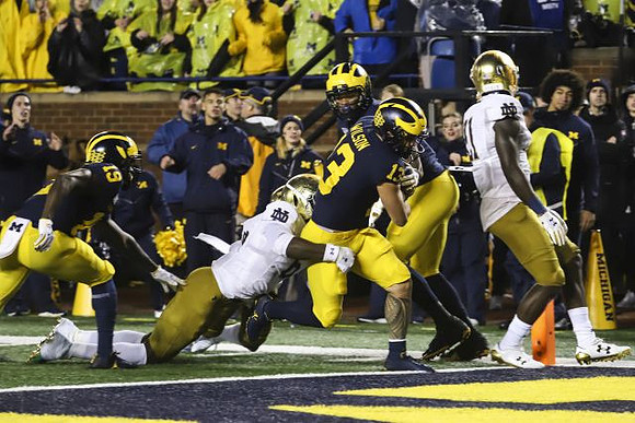 Mike Sainristil (19) and Tru Wilson (13)